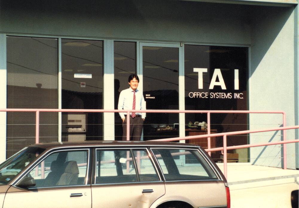 Jim Tai outside the Tai Office Systems storefront